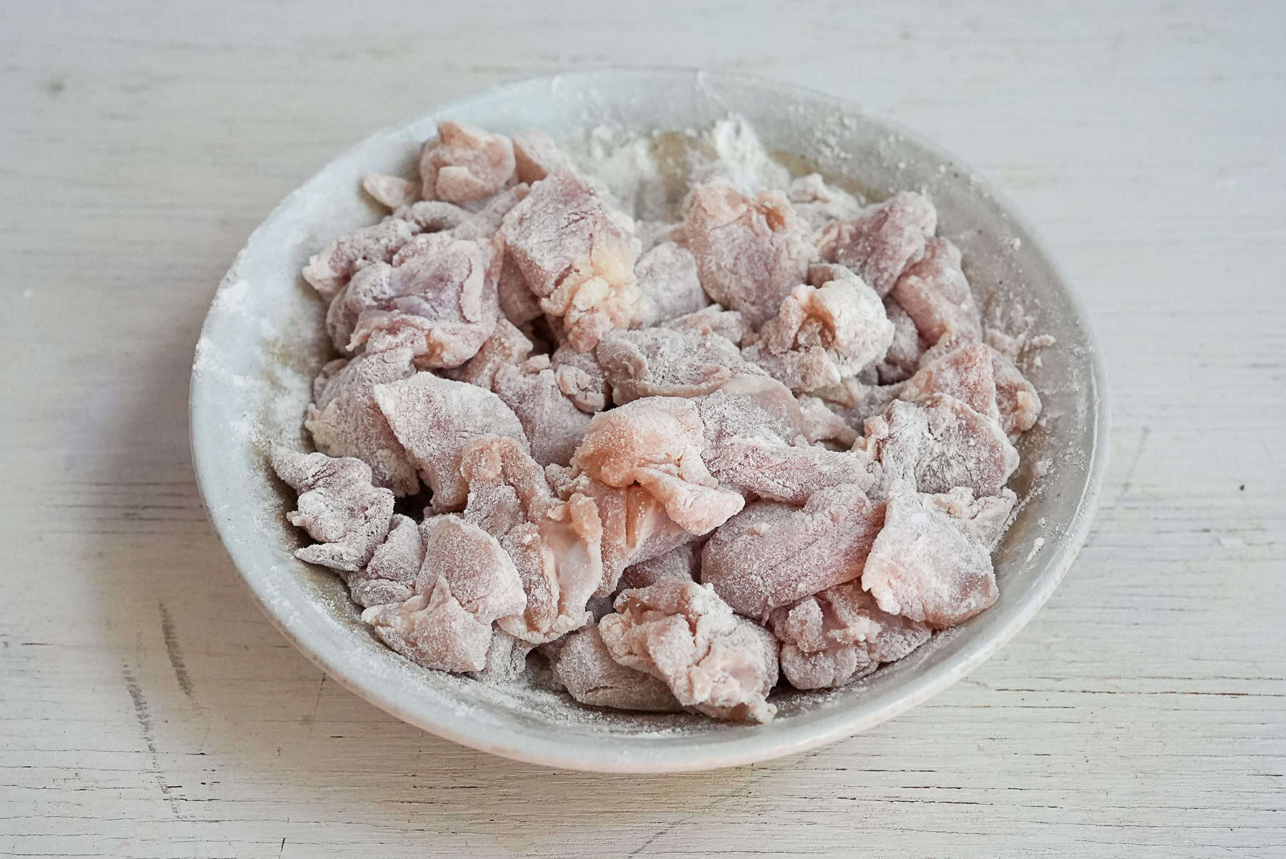 Coat the chicken with tempura flour