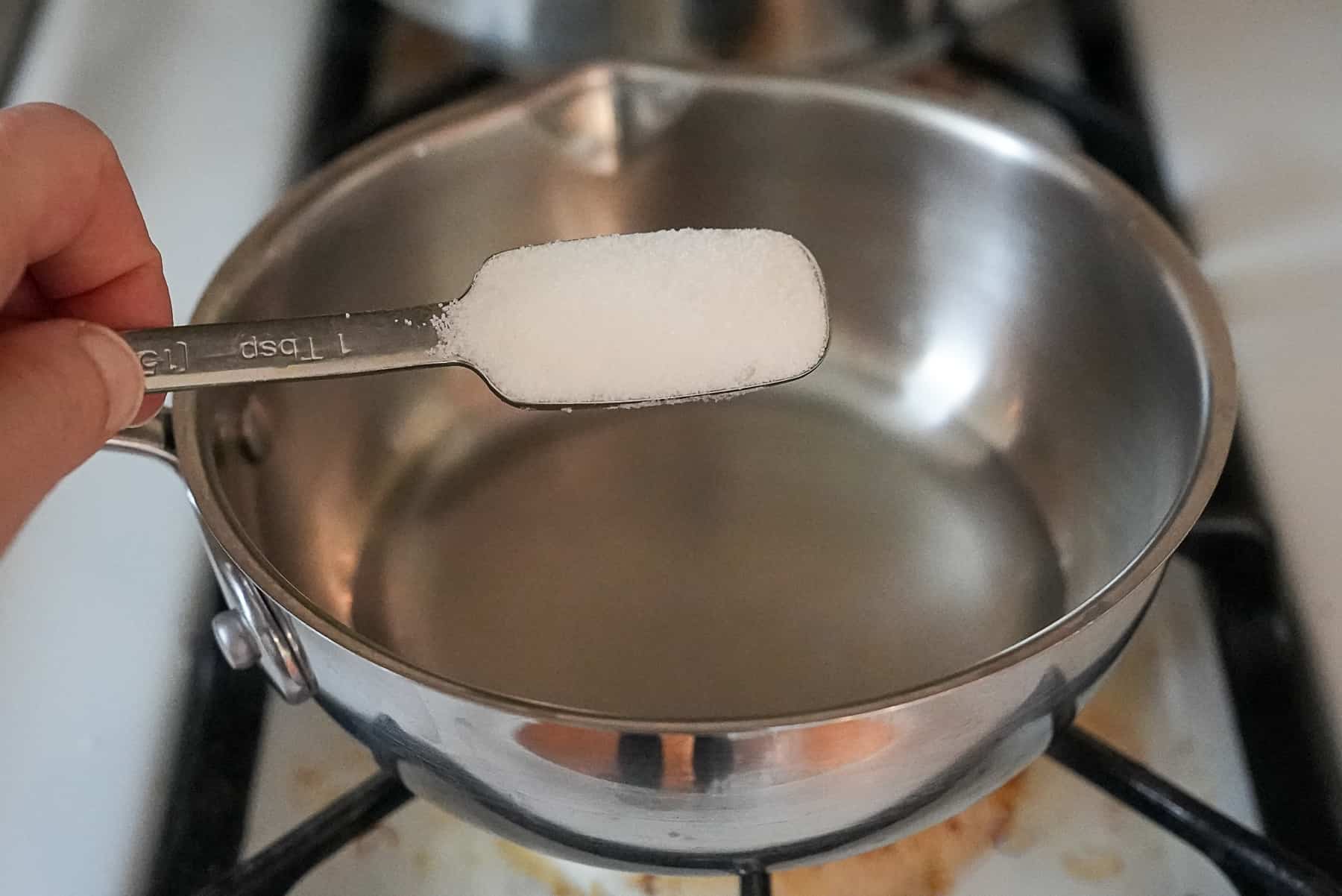Add the sugar to the water and vinegar