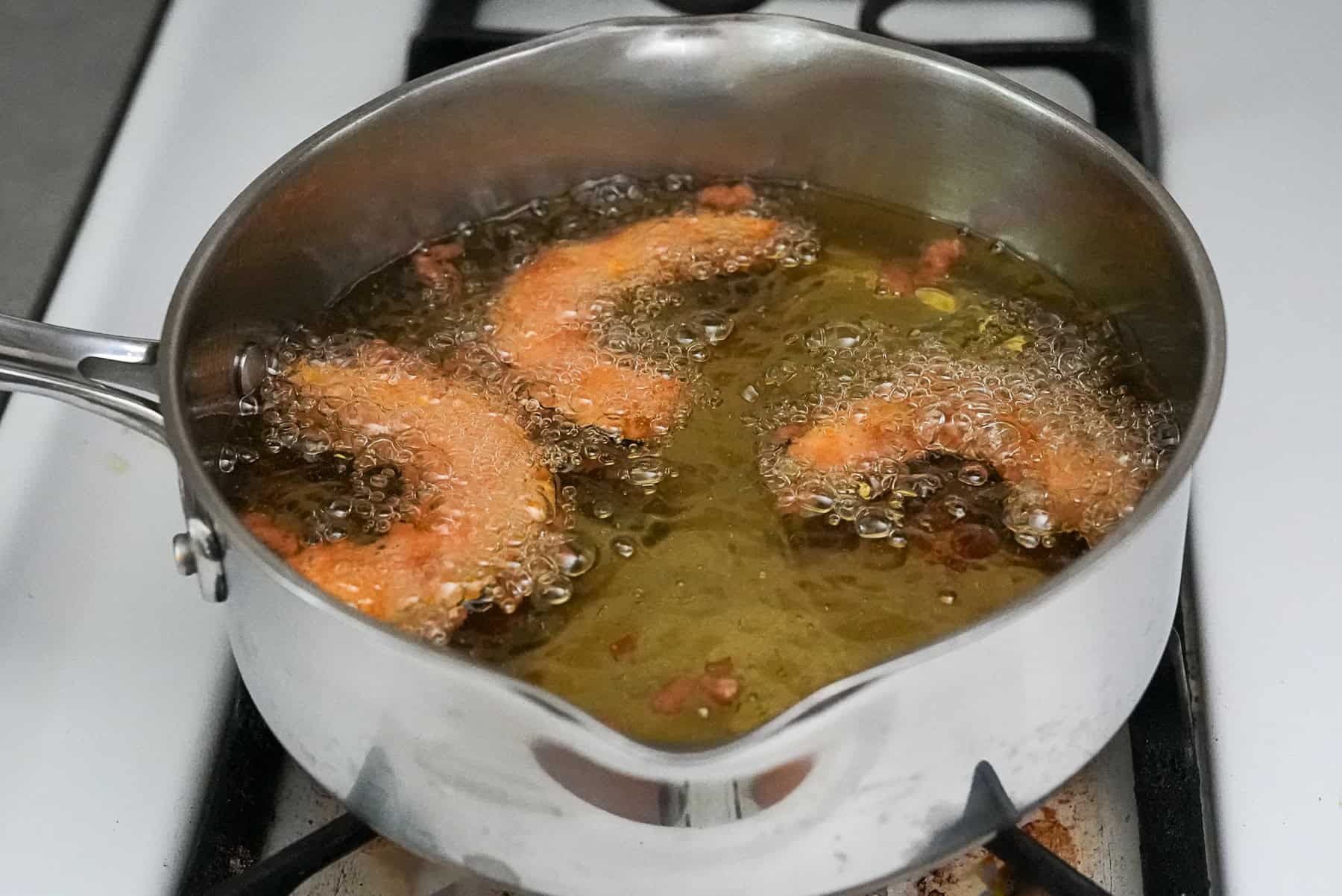 Deep fry the battered kabocha squash pieces 