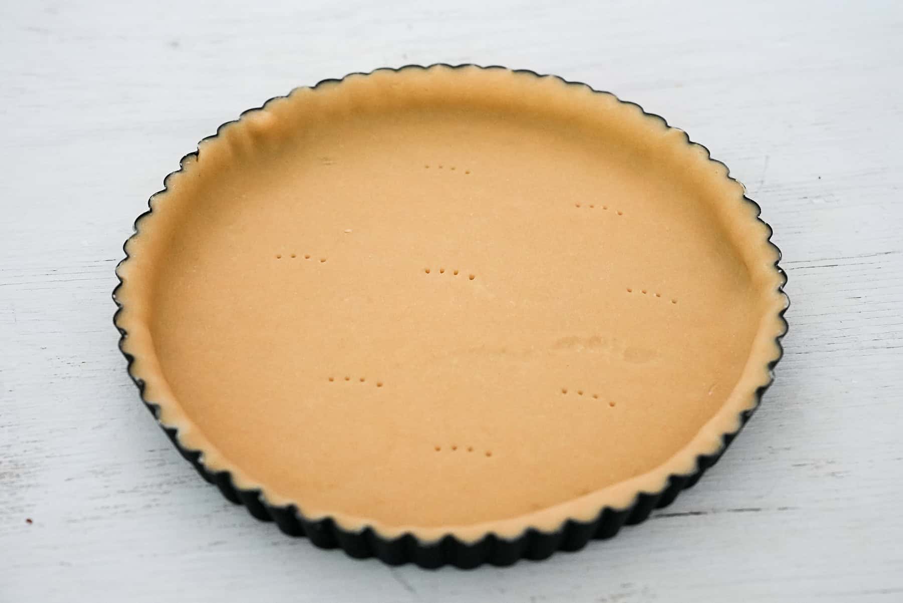 Roll out dough and fill tart pan