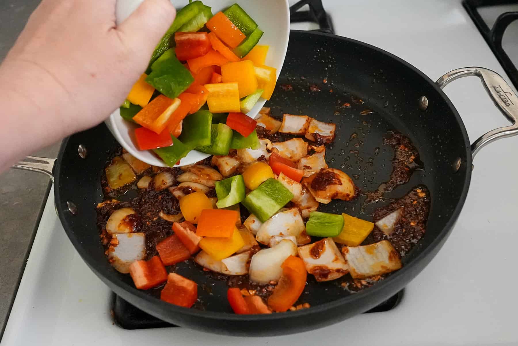 Add onions and bell peppers