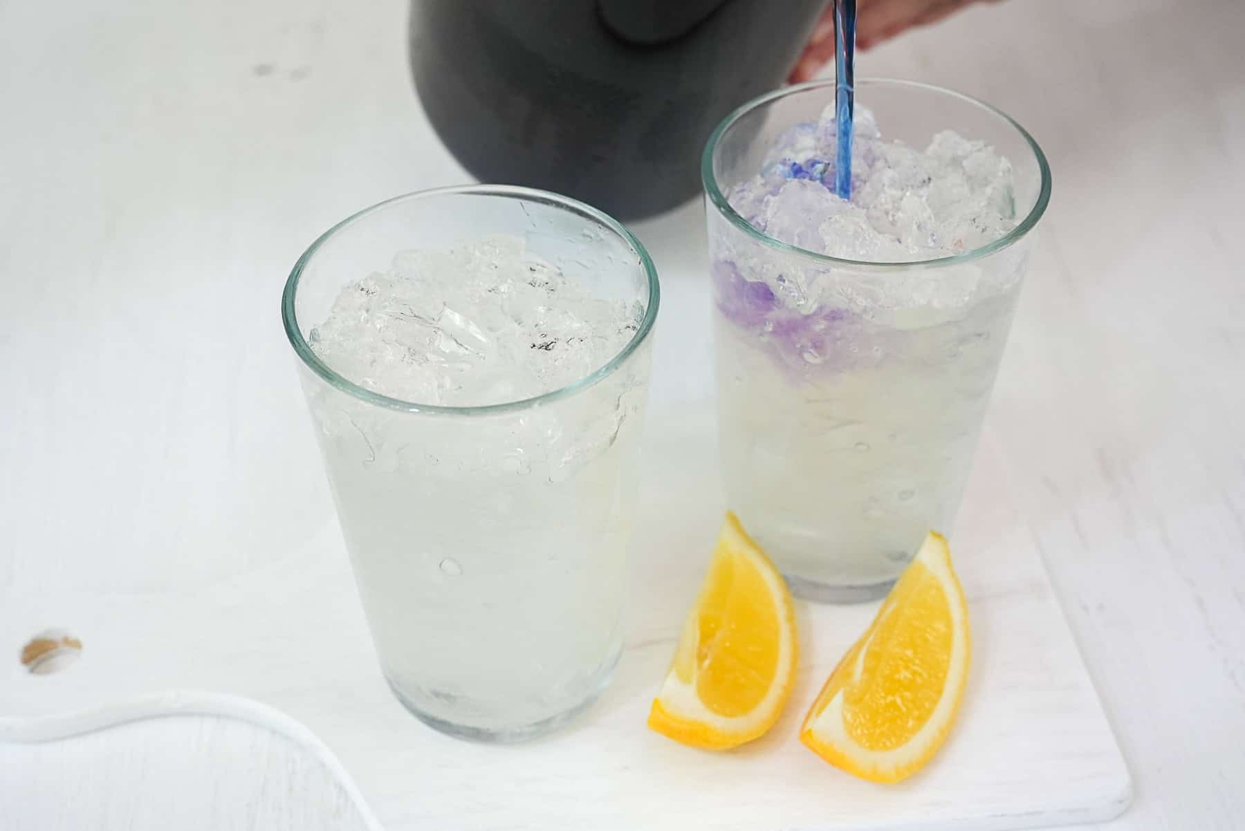 Add butterfly pea water to concentrated lemonade