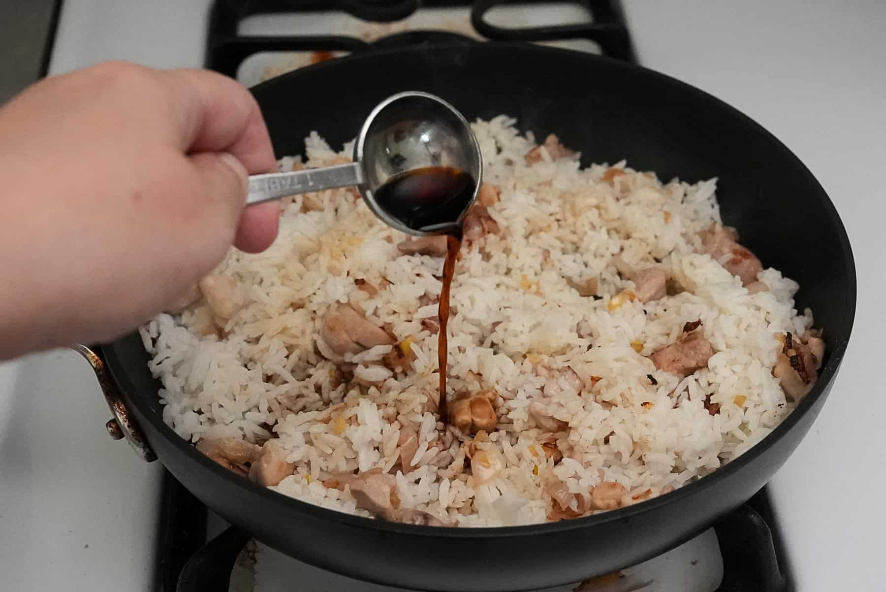 Add the rice and seasoning sauces