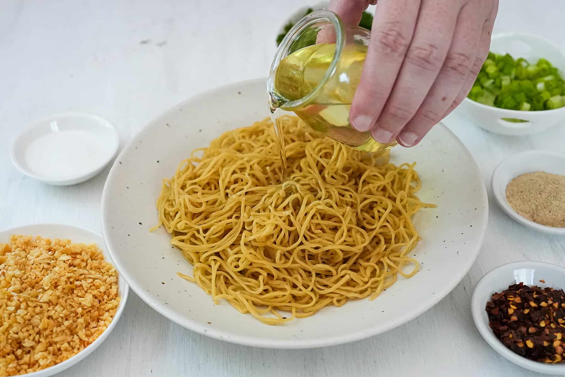 Add garlic oil to dry egg noodles