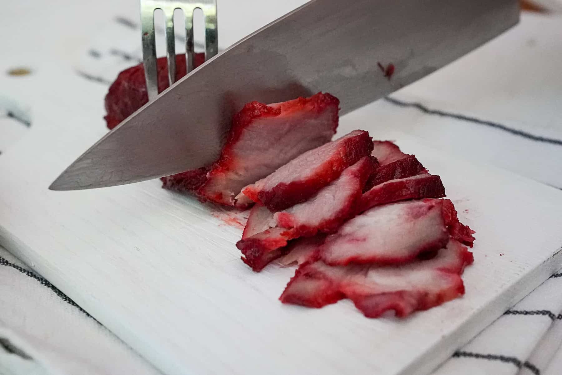 slice the red pork with a sharp knife