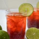 Thai Lime Tea known as Cha Manao with a slice of lime on the side