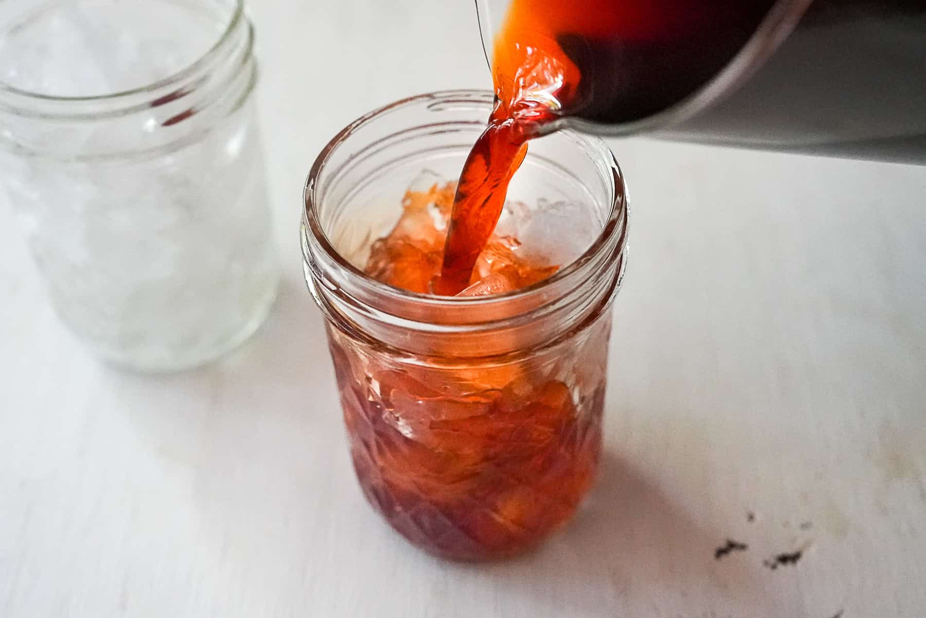 Pour the lime tea into a glass filled with ice